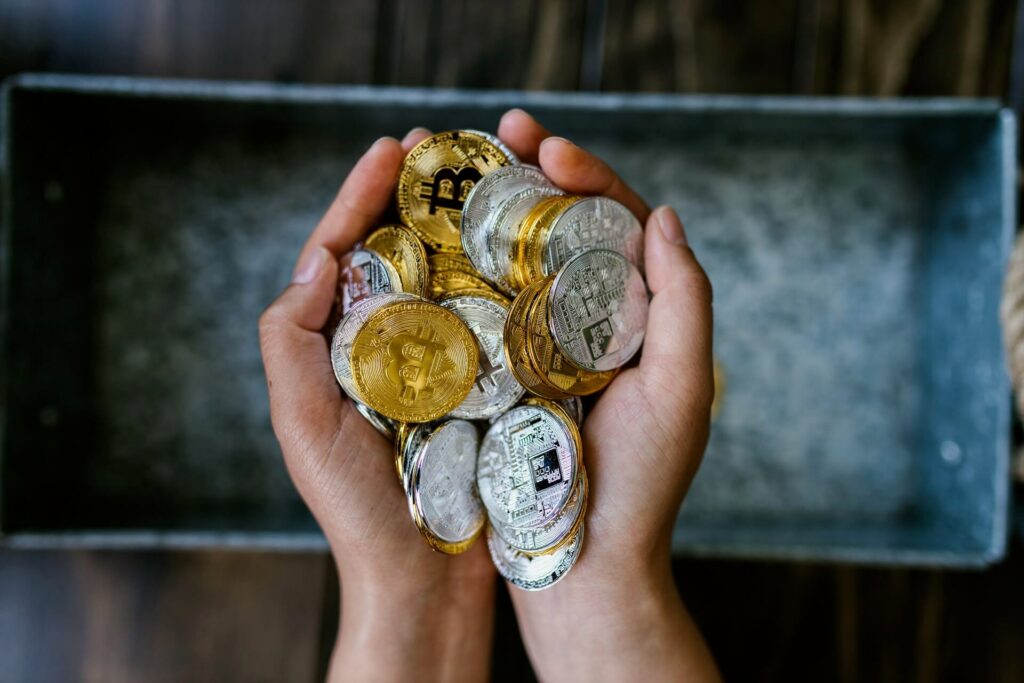  Person holding a bunch of bitcoins 