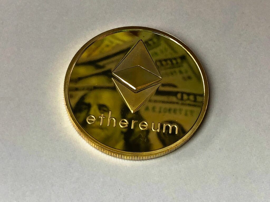Golden Ethereum token on the table. 